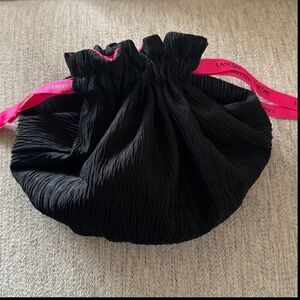 Lancome reversible black/pink drawstring make up bag

New, never used.